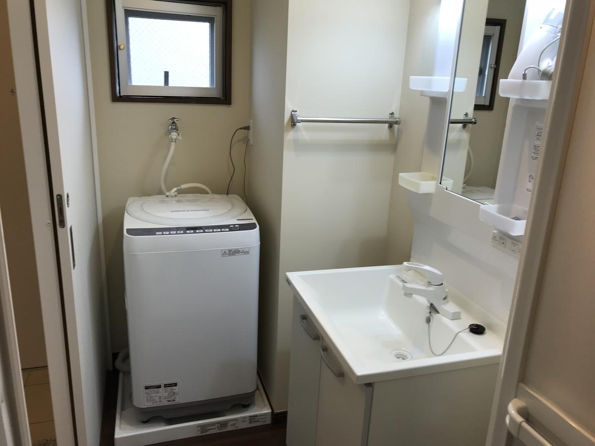 Appartamento Weekly Harbourview Mansion Ginowan Esterno foto