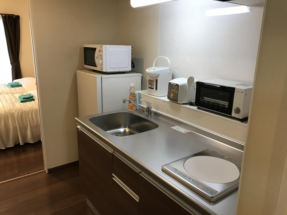 Appartamento Weekly Harbourview Mansion Ginowan Esterno foto
