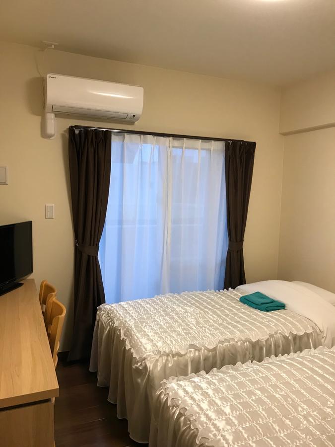 Appartamento Weekly Harbourview Mansion Ginowan Esterno foto